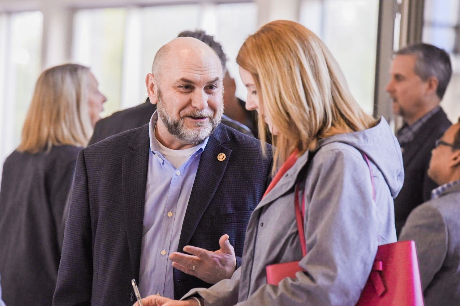 Todd Chaput, of the Economic Alliance of Lewis County, speaks to Centralia Mayor Kelly Smith Johnston during  a "Hydrogen Symposium" in the TransAlta Commons at Centralia College on Thursday.